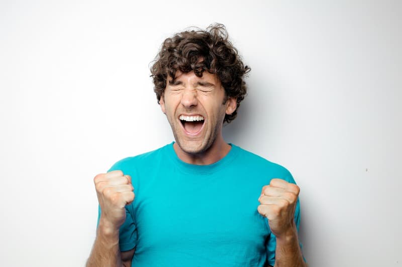 Happy man success by tinnitus management