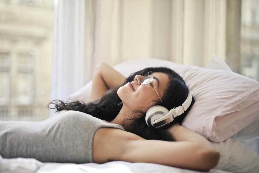 Conceptual image of a person mindfully listening, with a subtle 'stress-o-meter' graphic, symbolizing tinnitus as a stress detective for well-being.