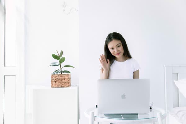 Woman with Laptop researching Tinnitus